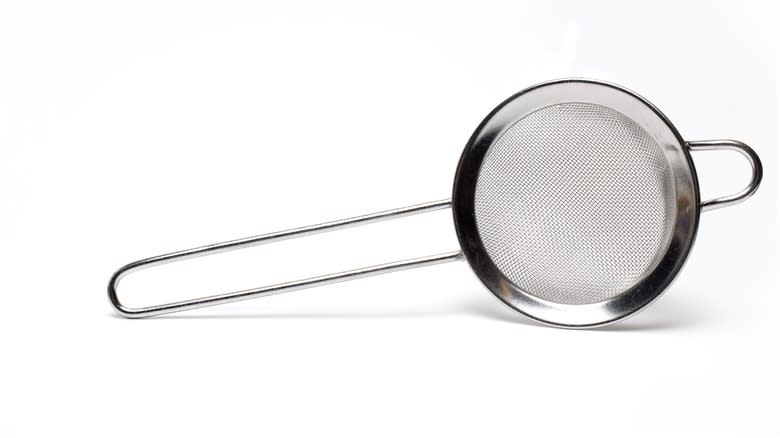 Strainer on white background