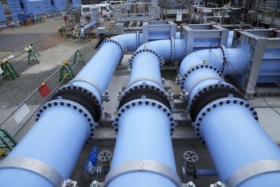 This photo taken during a tour for The Associated Press shows a blue pipeline to transport seawater, part of the facility for the release of treated radioactive water to sea from the Fukushima Daiichi nuclear power plant, operated by Tokyo Electric Power Company Holdings, also known as TEPCO, in Futaba town, northeastern Japan, Friday, July 14, 2023. (AP Photo/Hiro Komae)