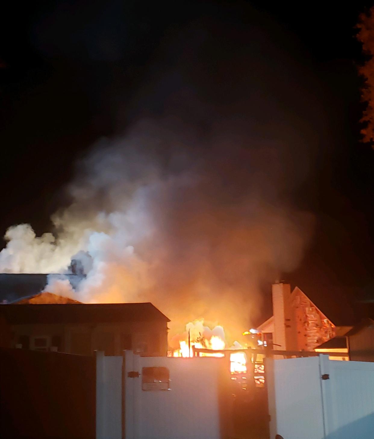 A neighbor awakened by sirens captured photos of a fire on Kate Drive in Thomasville Monday morning. The fire started in a garage behind a home. The fire spread to the home.