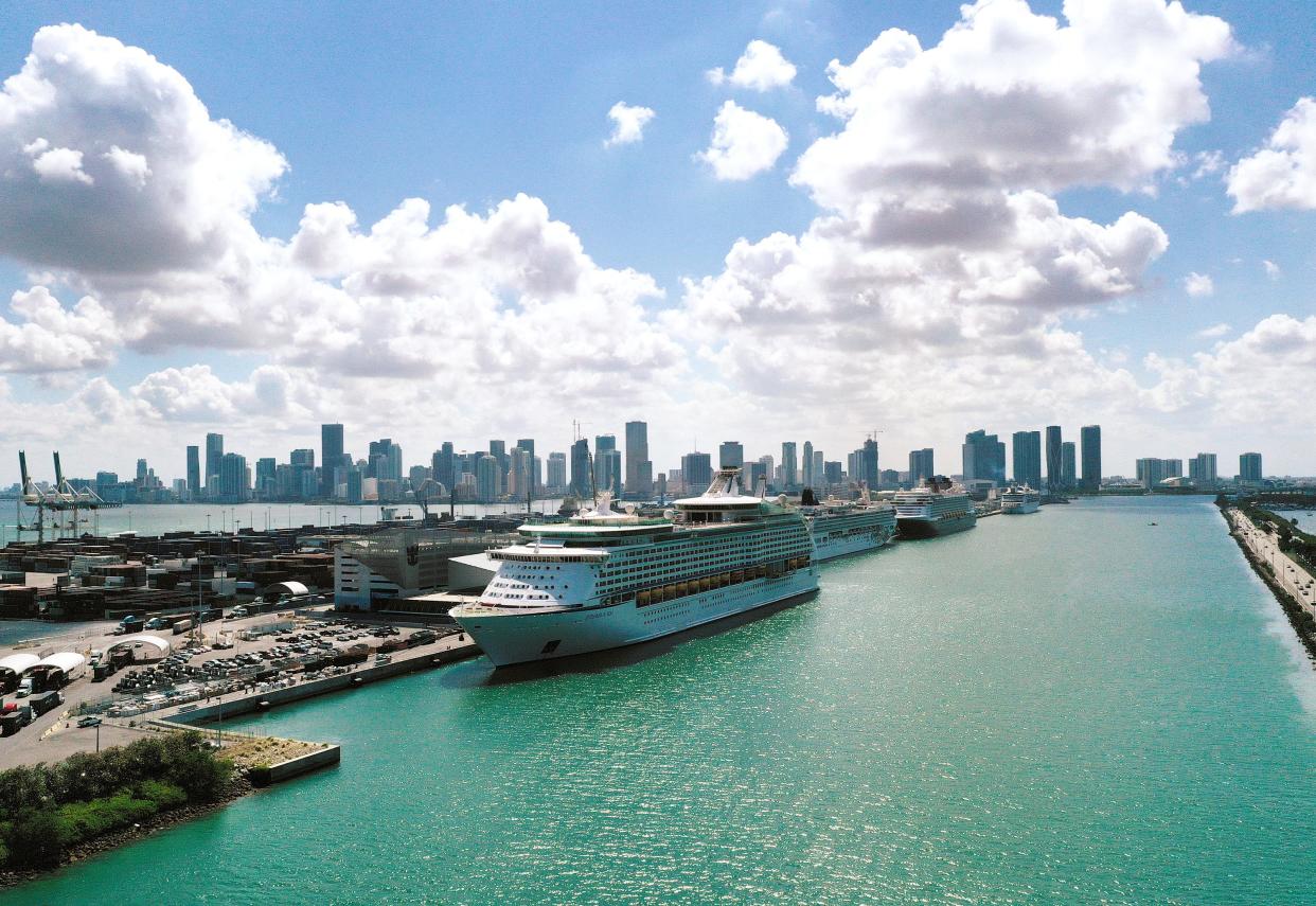  In an aerial view, Explorer of the Seas (front), a Royal Caribbean cruise ship, along with other cruise ships are docked at PortMiami as the cruise line industry waits to begin operations again on May 26, 2021 in Miami, Florida (Getty Images)