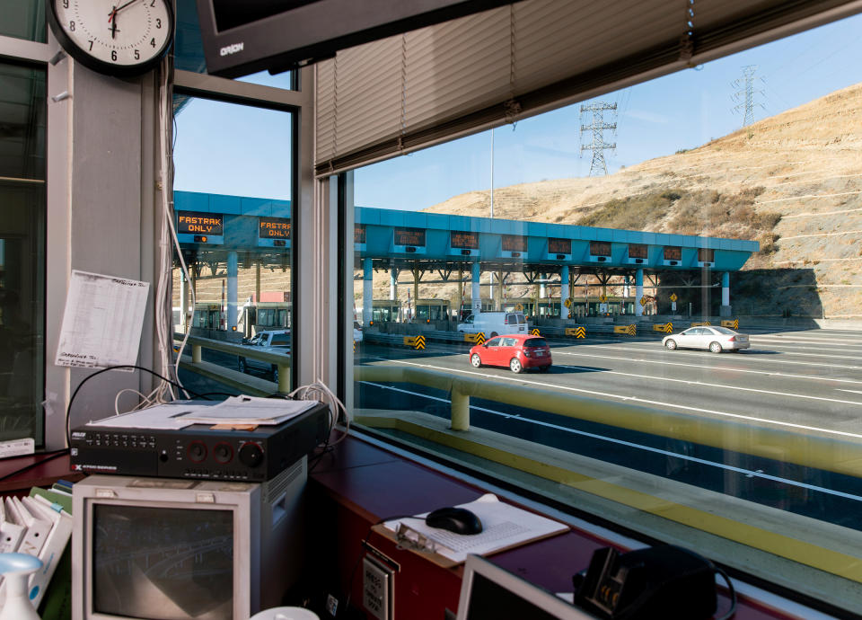 The Carquinez Bridge toll plaza in Vallejo, Calif., is empty of tollbooth collectors on July 30, the result of the state’s decision to automate the jobs at the start of the COVID-19 pandemic. For now, workers are being paid in exchange for taking online courses in other fields, but that’s not a benefit available to most of the millions of U.S. employees who have lost jobs during the pandemic. | Cayce Clifford for TIME