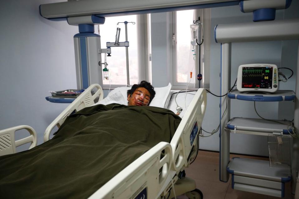 A Nepalese climbing guide recovers in hospital following a severe avalanche on Everest that killed 12 in 2014. EPA