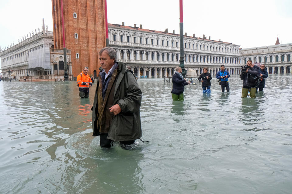 The Mayor of Venice Luigi Brugnaro walks on St Mark's Square during an exceptionally high water levels in Venice, Italy November 13, 2019. REUTERS/Manuel Silvestri