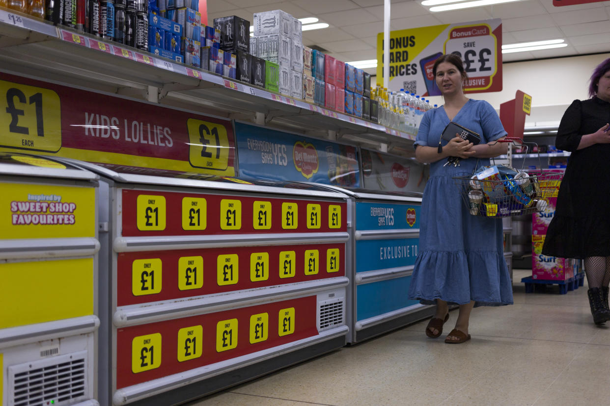 A woman carrying a basket full of groceries passes frozen foods on sale for only £1 in the aisle of an Iceland supermarket as the Office for National Statistics (ONS) announces inflation in the country rose to 9.1% in May, with food prices soaring on 21st June, 2022 in Wakefield, United Kingdom. (photo by Daniel Harvey Gonzalez/In Pictures via Getty Images)