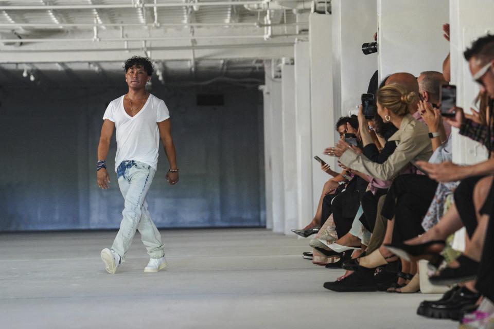 Fashion designer Prabal Gurung appears on the runway after showing his Spring Summer 2023 collection during Fashion Week, Saturday Sept. 10, 2022 in New York. (AP Photo/Bebeto Matthews)