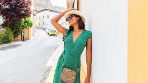 Shoot of young Brazilian fashionable woman walking the streets on summer day