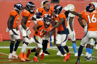 Denver Broncos wide receiver K.J. Hamler (13) celebrates his game-tying touchdown with teammates during the second half of an NFL football game against the Los Angeles Chargers, Sunday, Nov. 1, 2020, in Denver. The Broncos won 31-30. (AP Photo/Jack Dempsey)