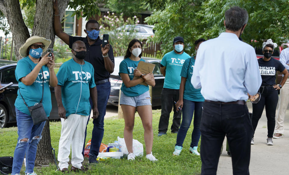 Texas Organizing Project volunteers listen to Beto O'Rourke speak before a neighborhood walk in West Dallas Wednesday, June 9, 2021. The former congressman and senatorial candidate is driving an effort to gather voter support to stop Texas' SB7 voting legislation. As politicians from Austin to Washington battle over how to run elections, many voters are disconnected from the fight. While both sides have a passionate base of voters intensely dialed in on the issue, a disengaged middle is baffled at the attention. (AP Photo/LM Otero)