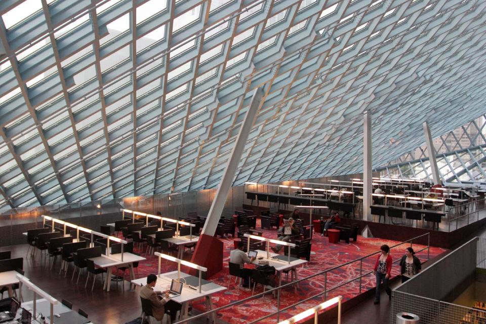 This image taken April 3, 2013 shows the interior of the Seattle Central Library in downtown Seattle. The $165 million building’s unusual design and decoration attracts visitors from all over the world. (AP Photo/Manuel Valdes)