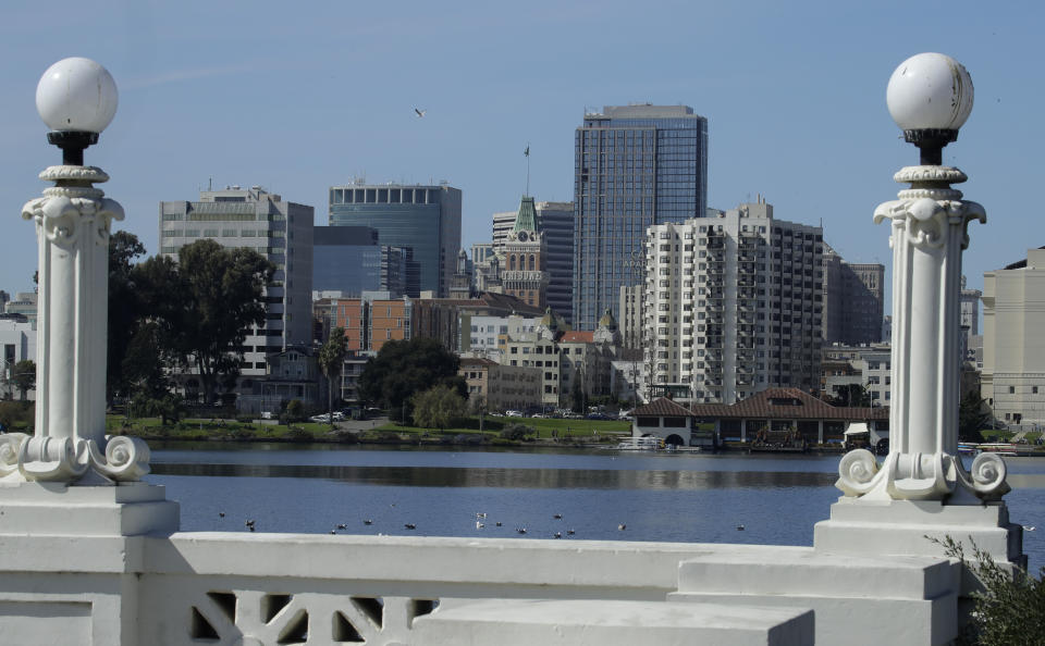 The Oakland skyline is seen from Lake Merritt on March 4, 2020, in Oakland, Calif. California Gov. Gavin Newsom said Thursday, Feb. 8, 2024, he is sending prosecutors to Oakland to help crackdown on rising crime in the San Francisco Bay Area city where brazen, broad daylight robberies have been getting national attention. (AP Photo/Ben Margot, File)