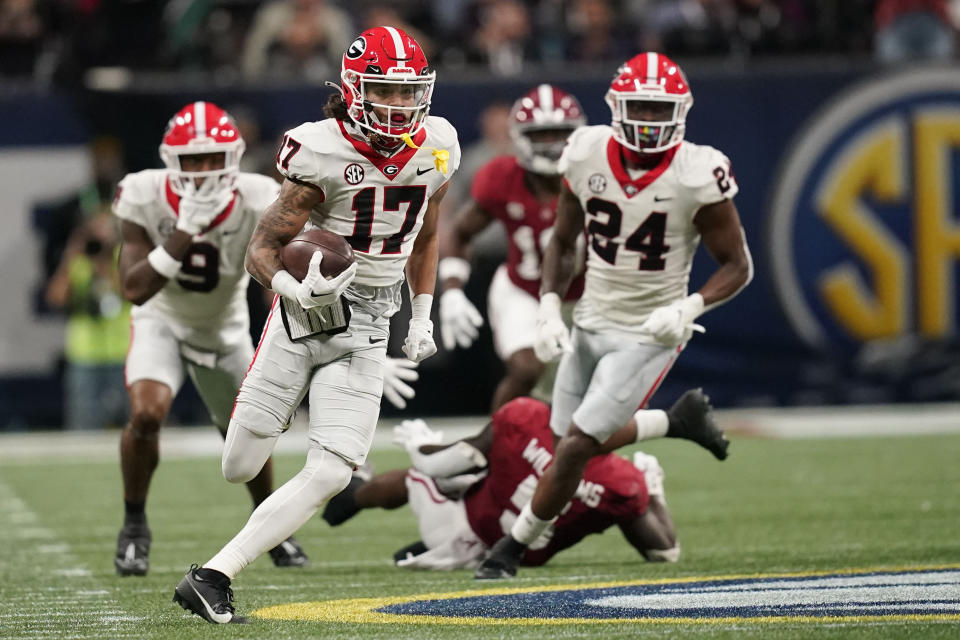 Georgia wide receiver Anthony Evans III (17) runs the ball during the second half of the Southeastern Conference championship NCAA college football game against Alabama in Atlanta, Saturday, Dec. 2, 2023. (AP Photo/Mike Stewart)