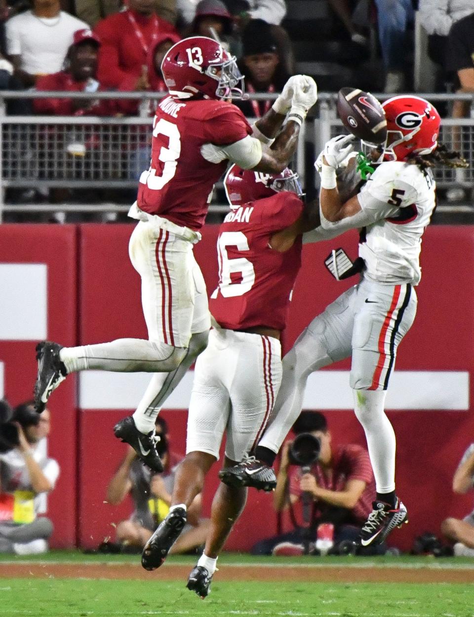 Sep 28, 2024; Tuscaloosa, Alabama, USA; Alabama Crimson Tide defensive back Malachi Moore (13) and Alabama Crimson Tide defensive back Red Morgan (16) break up a pass intended for Georgia Bulldogs wide receiver Anthony Evans III (5) at Bryant-Denny Stadium. Alabama defeated Georgia 41-34. Mandatory Credit: Gary Cosby Jr.-Imagn Images