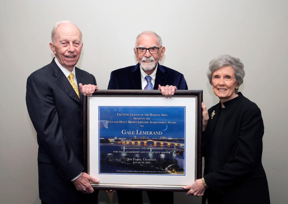 J. Hyatt and Cici Brown present the Civic League of the Halifax Area's "Cici and Hyatt Brown Lifetime Achievement Award" to local philanthropist/business leader L. Gale Lemerand, center, "in recognition of (his) leadership and community service" at the organization's annual dinner at Oceanside Country Club in Ormond Beach on Saturday, Jan. 20, 2024.