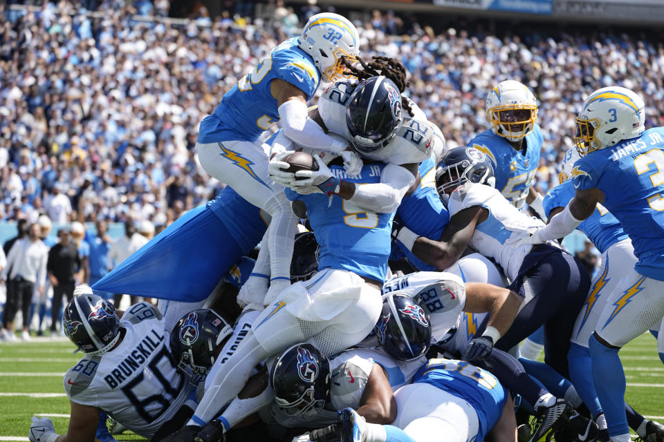 Tennessee Titans running back Derrick Henry (22) lunges into the end zone for a touchdown during the first half of an NFL football game against the Los Angeles Chargers Sunday, Sept. 17, 2023, in Nashville, Tenn. (AP Photo/George Walker IV)