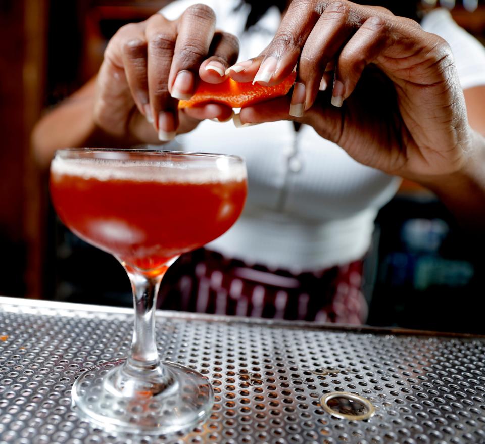 Loretha Kirk, a bartender ranked by the U.S. Bartending Guild as a World Class US Top 100 bartender for 2024, mixes a drink inside the T Room at The Jones Assembly on Feb. 20.