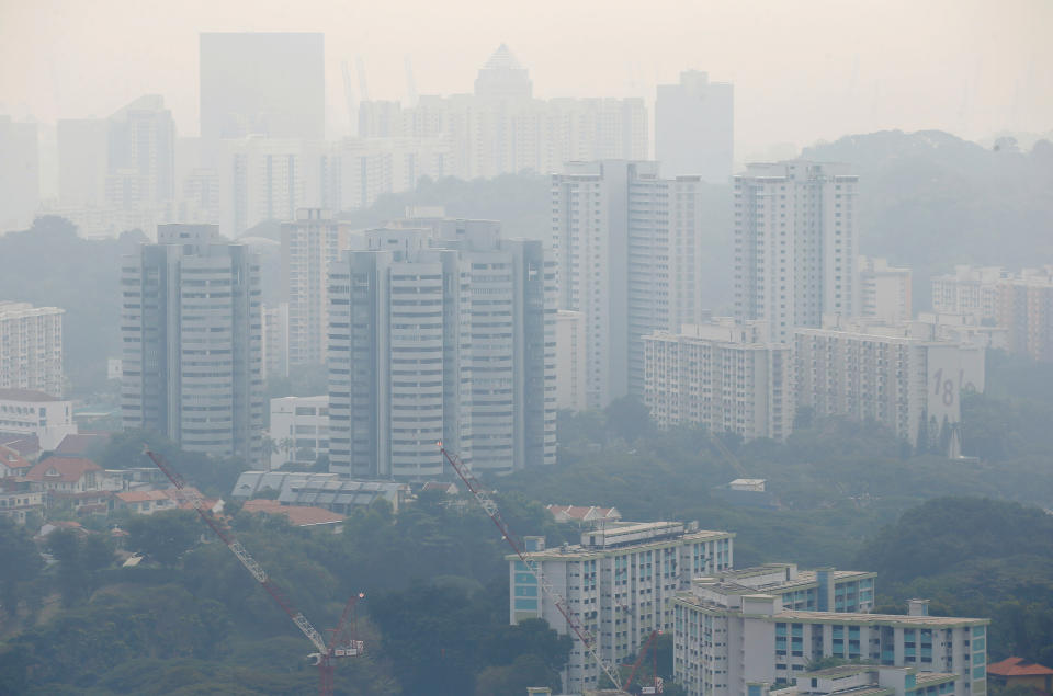Public housing apartment blocks are shrouded by haze in Singapore September 13, 2019. REUTERS/Feline Lim
