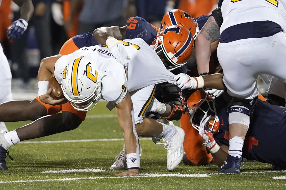 Illinois' Seth Coleman (49) and Jer'Zhan Newton sack Chattanooga quarterback Preston Hutchinson during the second half of an NCAA college football game Thursday, Sept. 22, 2022, in Champaign, Ill. (AP Photo/Charles Rex Arbogast)