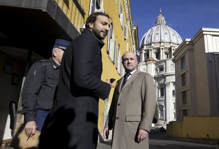 Journalists Gianluigi Nuzzi (R) and Emiliano Fittipaldi (C) arrive at the Vatican November 24, 2015. REUTERS/Alessandro Bianchi