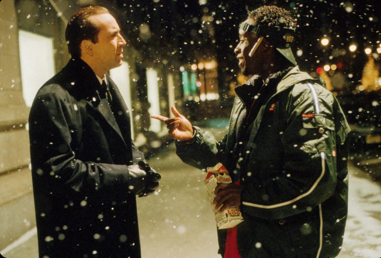 From left, Nicolas Cage and Don Cheadle star in 2000's "The Family Man."