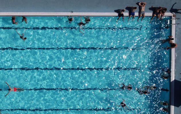 An aerial view shows people swimming in the sun at Hathersage Swimming Pool, west of Sheffield in northern England, on Monday. (Photo: OLI SCARFF via Getty Images)