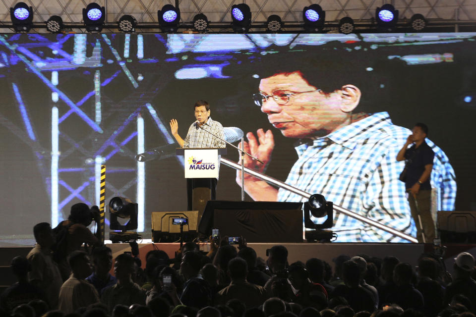 Former Philippine President Rodrigo Duterte gestures during his speech in Davao, southern Philippines late Sunday Jan. 28, 2024. Former President Duterte is throwing allegations at his successor, Fernando Marcos Jr., and even raising the prospect of removing him from office, bringing into the open a long-rumored split between the two. (AP Photo/Manman Dejeto)