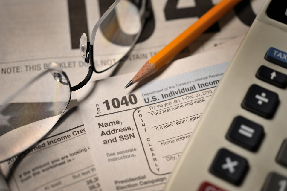 Accountant&#39;s view of filing annual taxes; selective focus on numerals 