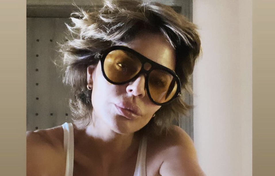 Lisa Rinna poses in white swimsuit in a belated-birthday post on Instagram. (Instagram)