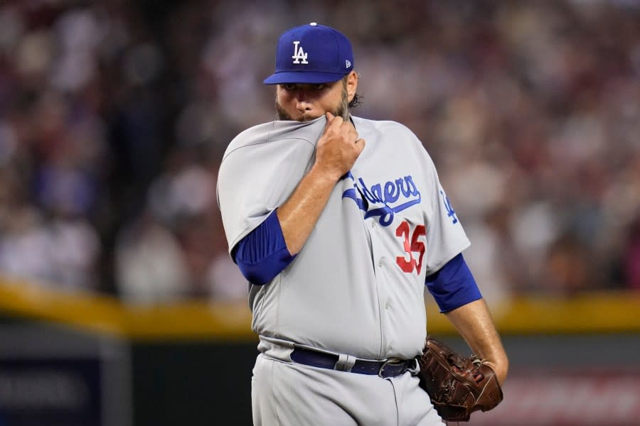 Los Angeles Dodgers starting pitcher <span class="caas-xray-inline-tooltip"><span class="caas-xray-inline caas-xray-entity caas-xray-pill rapid-nonanchor-lt" data-entity-id="Lance_Lynn" data-ylk="cid:Lance_Lynn;pos:3;elmt:wiki;sec:pill-inline-entity;elm:pill-inline-text;itc:1;cat:Athlete;" tabindex="0" aria-haspopup="dialog"><a href="https://search.yahoo.com/search?p=Lance%20Lynn" data-i13n="cid:Lance_Lynn;pos:3;elmt:wiki;sec:pill-inline-entity;elm:pill-inline-text;itc:1;cat:Athlete;" tabindex="-1" data-ylk="slk:Lance Lynn;cid:Lance_Lynn;pos:3;elmt:wiki;sec:pill-inline-entity;elm:pill-inline-text;itc:1;cat:Athlete;" class="link ">Lance Lynn</a></span></span> wipes his face with his jersey after giving up three home runs during the third inning in Game 3 of a baseball NL Division Series against the Los Angeles Dodgers, Wednesday, Oct. 11, 2023, in Phoenix. (AP Photo/Ross D. Franklin)