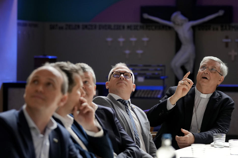 Bishop of Antwerp, Johan Bonny, right, speaks during a media conference at a church in Lier, Belgium, Wednesday, May 24, 2023. Across Europe, the continent that nurtured Christianity for most of two millennia, many churches, convents, beguinages and chapels stand empty and increasingly derelict as faith and church attendance have shriveled over the past half century. Many have now been repurposed for other activities to preserve their historical and architectural relevance. (AP Photo/Virginia Mayo)