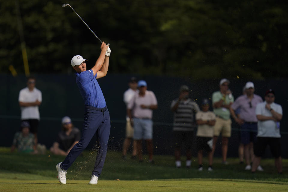 Jordan Spieth watches his shot from the fairway on the 12th hole during the second round of the BMW Championship golf tournament at Wilmington Country Club, Friday, Aug. 19, 2022, in Wilmington, Del. (AP Photo/Julio Cortez)