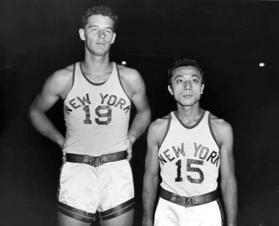 Waturu Misaka, right, seen with Lee Knorek as a member of the New York Knicks. (George Torrie/NY Daily News via Getty Images)