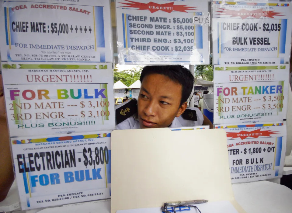 Finance-economy-Philippines-shipping-labour, by Jason Gutierrez An employee of a Philippine staffing agency for seafarers mans the recruiting booth at a seafarer&#39;s park in Manila on October 24. The Philippines supplies a third of the worlds merchant mariners, whose remittances help to buoy the economy amids the global credit crisis. Analysts say, the seafarers will hardly feel the pinch, with Filipino seamen consierec among the world&#39;s best.     AFP PHOTO/LUIS LIWANAG (Photo credit should read LUIS LIWANAG/AFP via Getty Images)