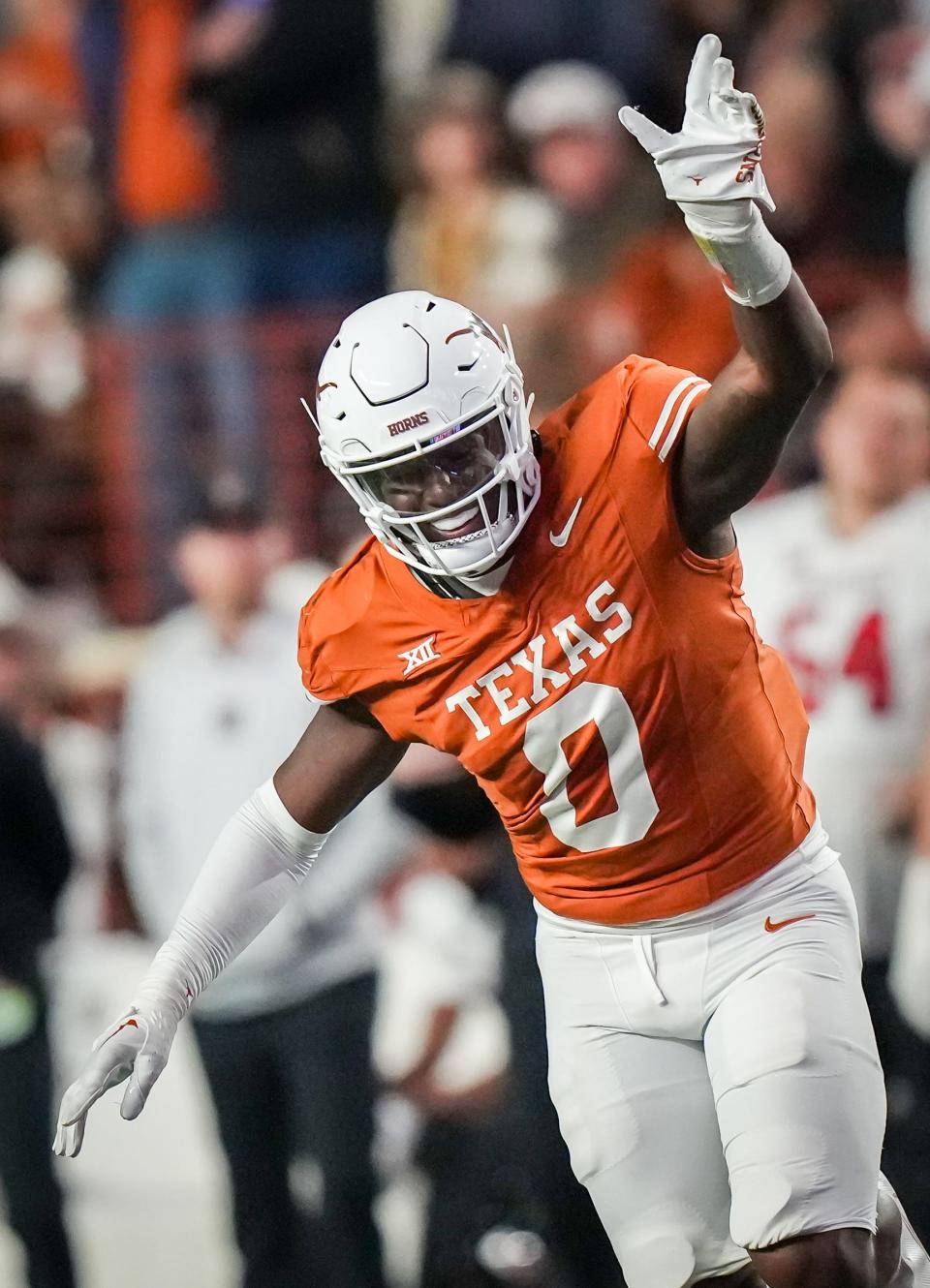 Texas linebacker Anthony Hill Jr. celebrates a second-quarter play in Friday night's 57-7 win over Texas Tech, which advanced the Longhorns to next week's Big 12 championship game.