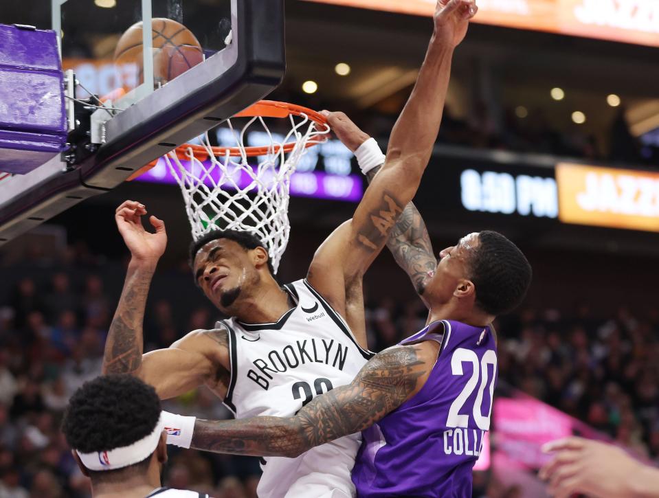 Utah Jazz forward John Collins (20) tries to dunk over Brooklyn Nets center Day’Ron Sharpe (20) in Salt Lake City on Monday, Dec. 18, 2023. The Jazz won 125-108. | Jeffrey D. Allred, Deseret News