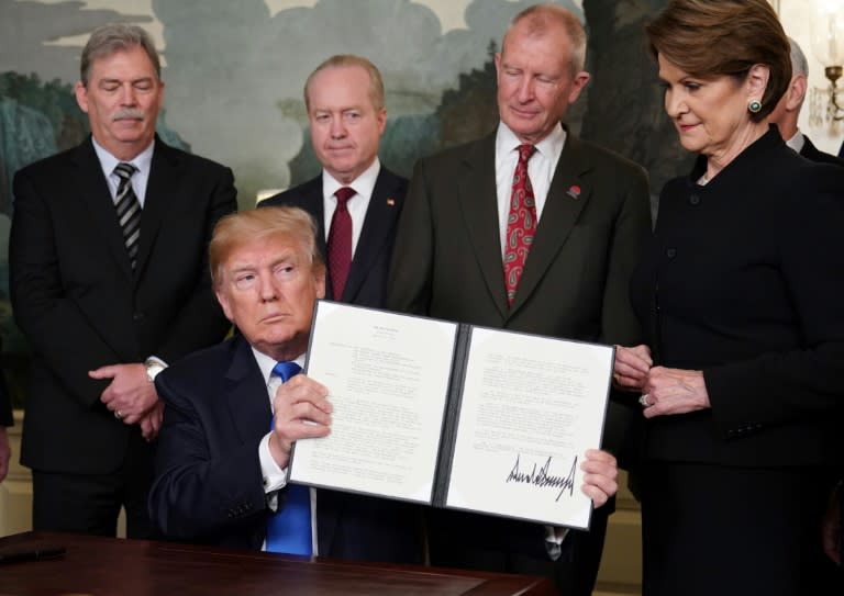 In what he called "the first of many" trade actions, President Donald Trump signed an order imposing tariffs on as much as $60 billion in Chinese products