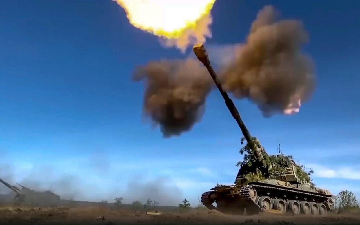 A Russian self-propelled gun fires towards Ukrainian positions - RUSSIAN DEFENSE MINISTRY PRESS SERVICE/AP