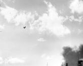 <p>A Japanese Type 00 (Zero) carrier fighter trails smoke after it was hit by anti-aircraft fire during the attack on Pearl Harbor on Dec. 7, 1941. (U.S. Navy/National Archives/Handout via Reuters) </p>