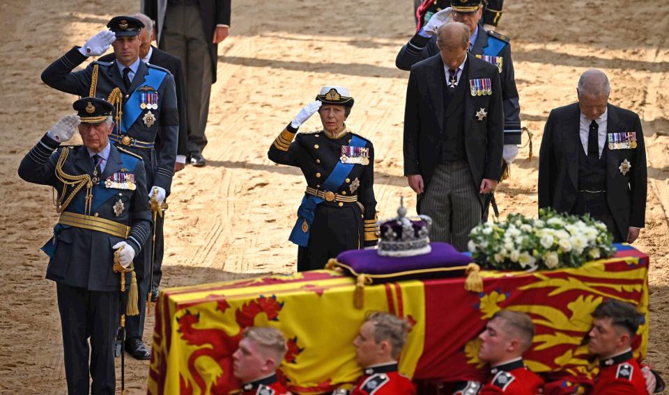 The royal family salutes the Queen's coffin outside of Westminster Hall.