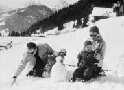 <p><strong>Prince Rainier III</strong> and <strong>Grace Kelly of Monaco</strong> make snowmen with their children <strong>Caroline and Albert </strong>outside their chalet in the Swiss region of <strong>Schonried</strong>, not far from the better known resort in Gstaad.</p>