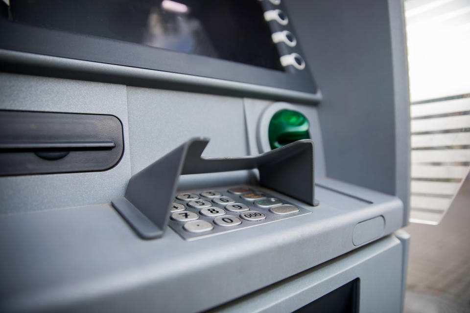 ATM cash machine close up, operating and functional, no people around.