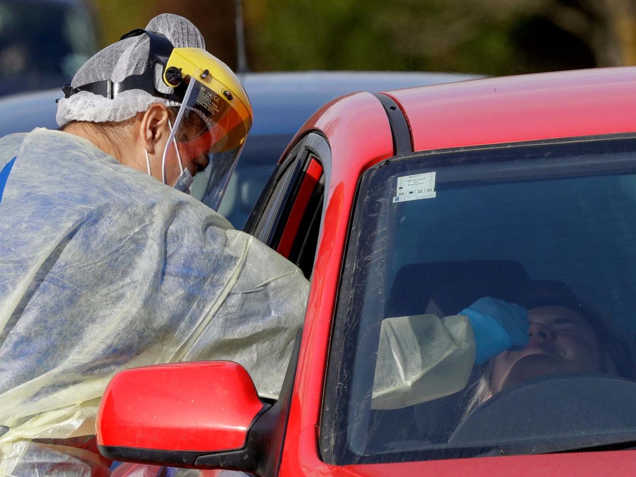 Drive-through testing at a facility in Christchurch after a cluster of new cases: AP