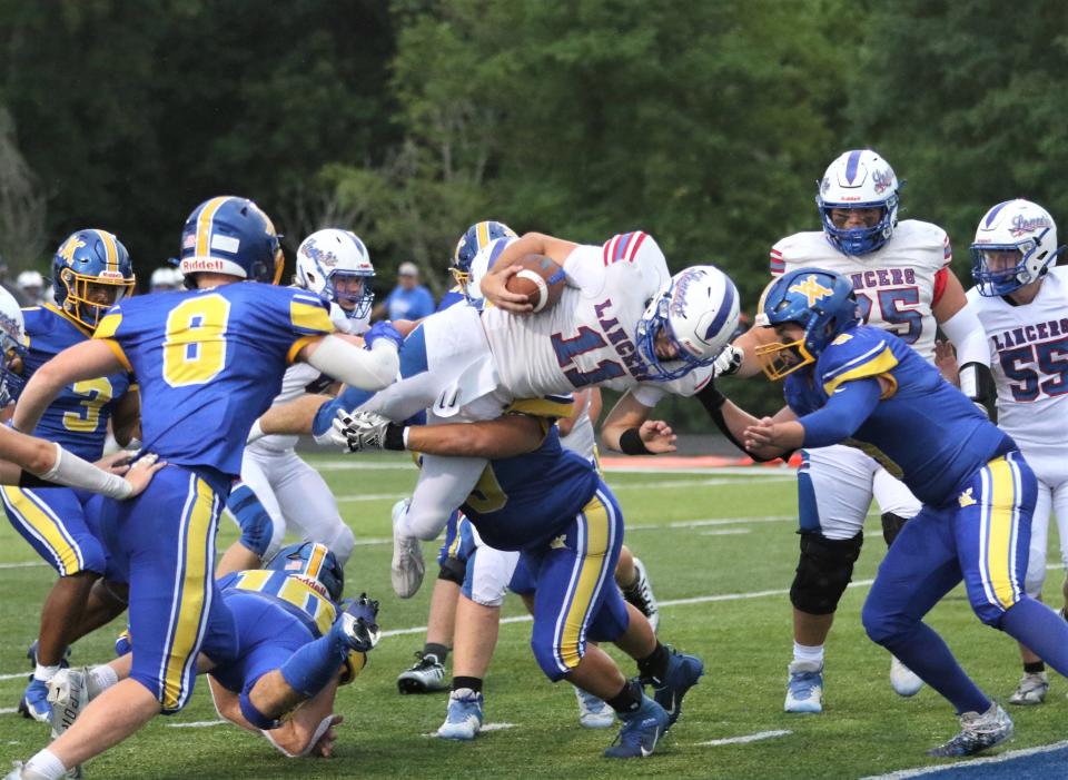 Lakewood's Adam Crawford dives in for a touchdown during Thursday's game at West Muskingum.