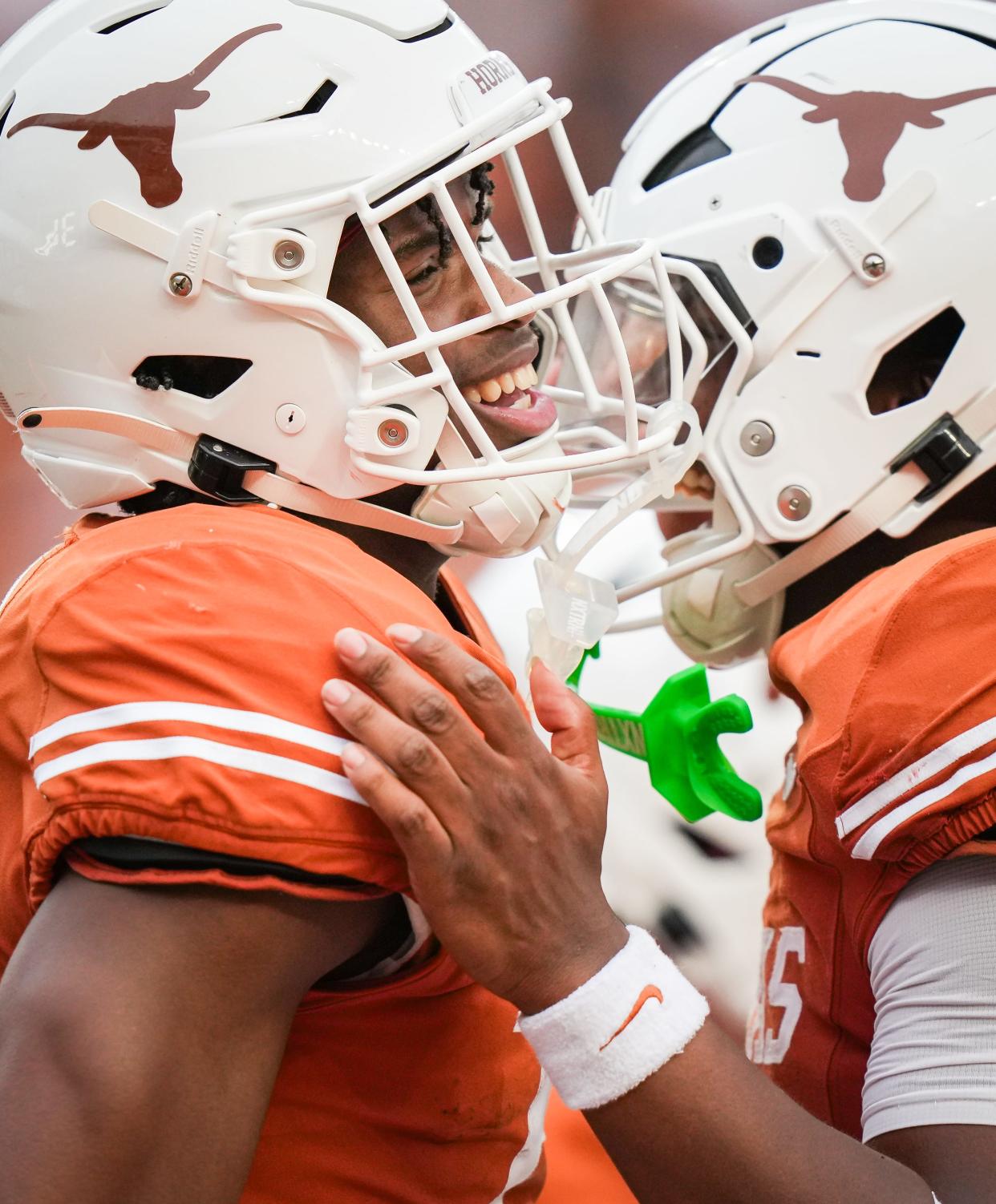 Texas wide receiver Ryan Wingo, left, celebrates a touchdown catch in the second quarter during Saturday's Orange-White spring game at Royal-Memorial Stadium. The annual scrimmage closed out the Longhorns' spring football workouts. The season opener is Aug. 31.