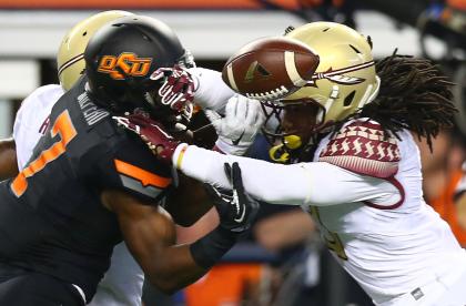 Ronald Darby (R) gets in on a tackle vs. Oklahoma State. (Getty Images) 