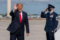 <p>Trump waves to the small group gathered at the airport in Palm Beach, Florida, as he disembarks Air Force One for the final time on Wednesday.</p>