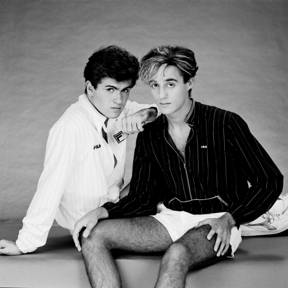 black and white photo of two young men posing