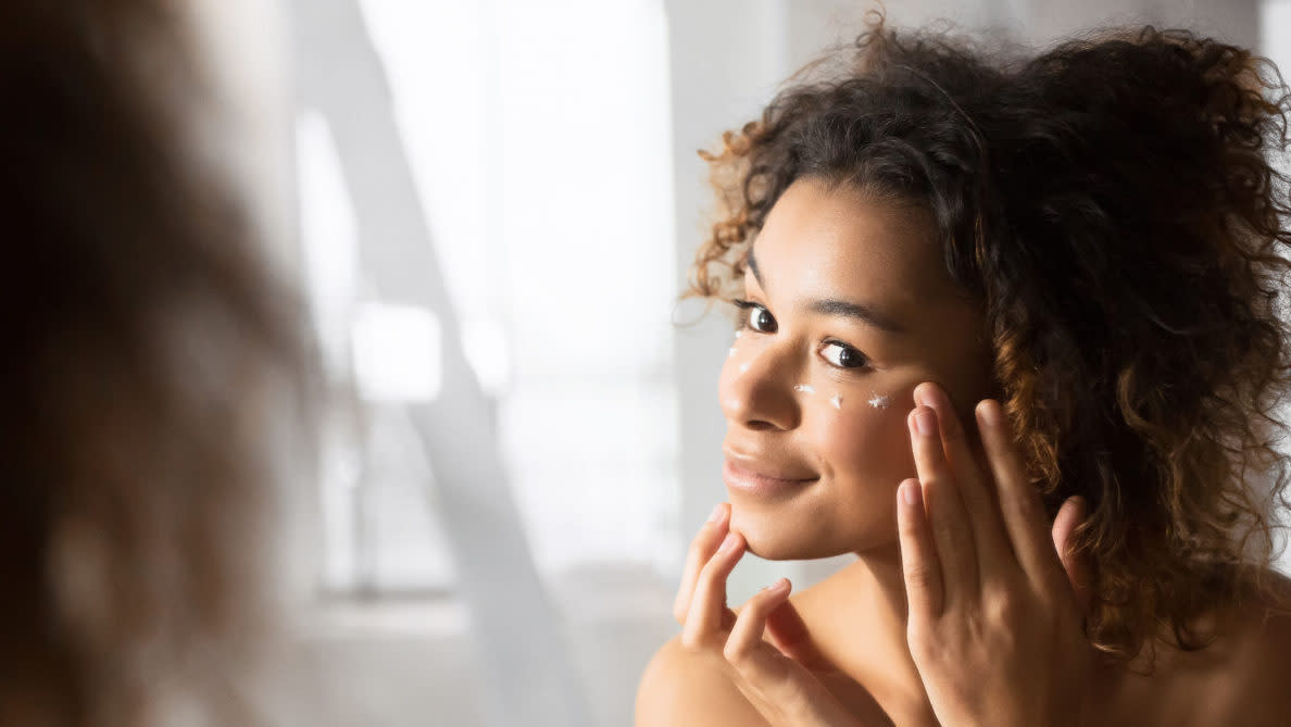 woman applying eye cream