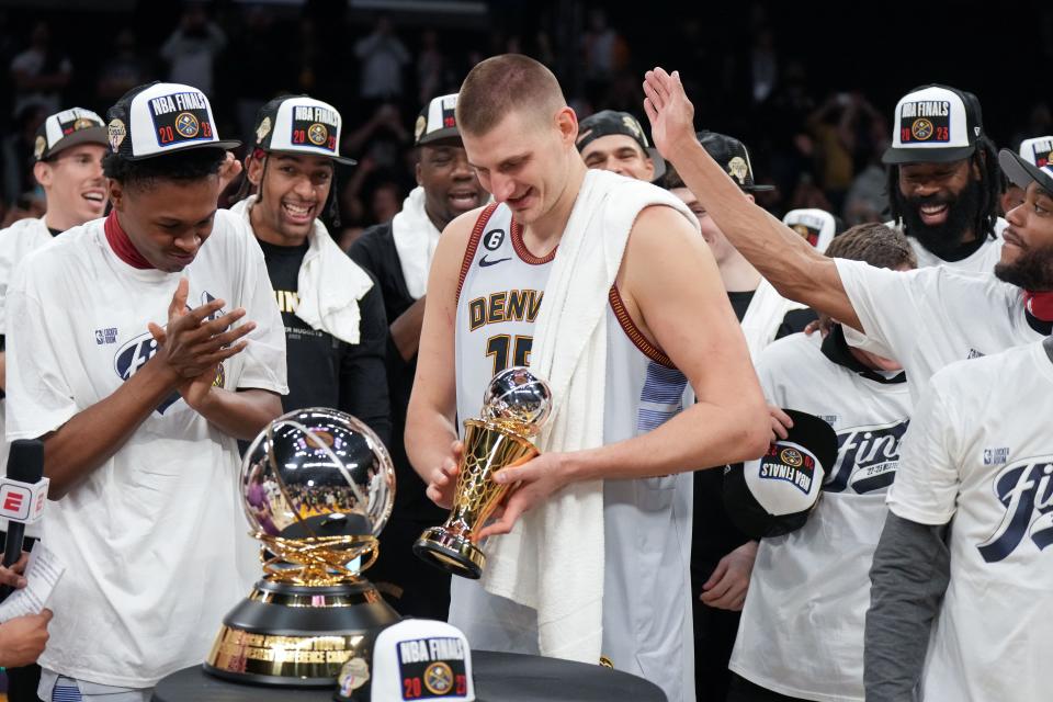Denver Nuggets center Nikola Jokic (15) celebrates winning the Western Conference MVP Trophy and beating the Los Angeles Lakers in game four of the Western Conference Finals for the 2023 NBA playoffs at Crypto.com Arena.