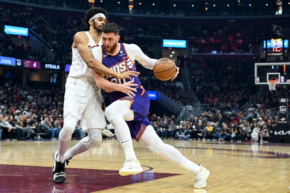 Jusuf Nurkic #20 of the Phoenix Suns drives to the basket against Jarrett Allen #31 of the Cleveland Cavaliers during the first half at Rocket Mortgage Fieldhouse on March 11, 2024, in Cleveland, Ohio.