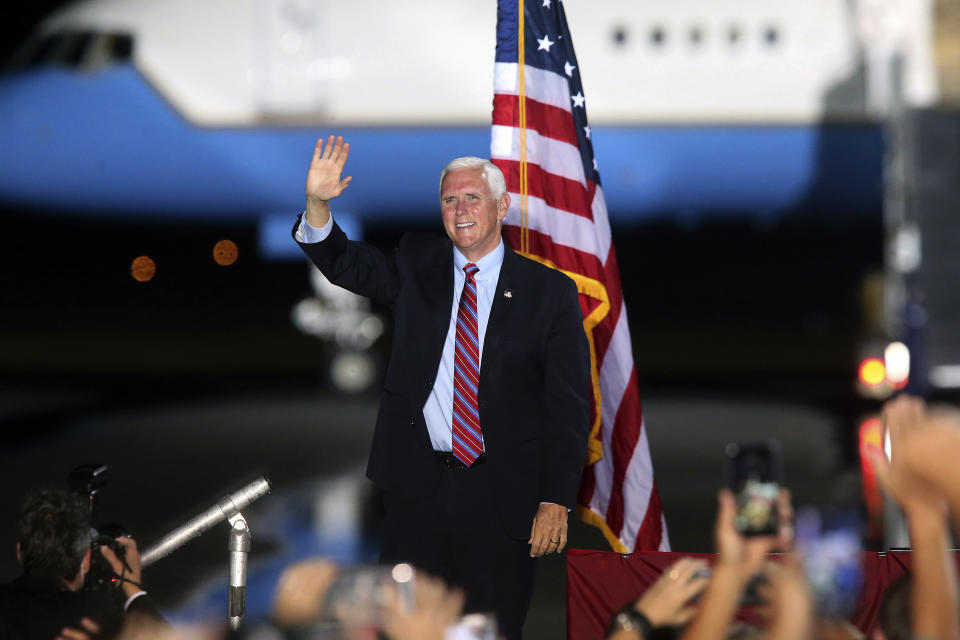 Vice President Mike Pence waves to supporters Saturday Oct. 24, 2020 in Tallahassee, Fla. Battleground Florida was again a central focus of the presidential campaign Saturday as President Donald Trump, Vice President Mike Pence and former President Barack Obama all had high-profile events in the state. (AP Photo/Steve Cannon)